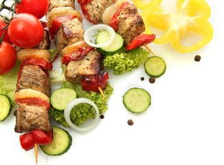 tasty grilled meat and vegetables on skewers, isolated on white