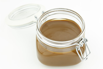 thick caramel in glass jar