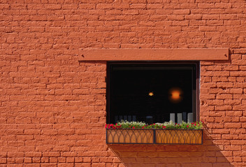 Light in Window in Brick Building