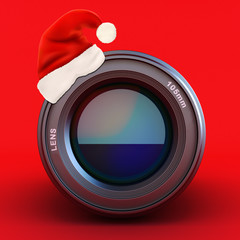 Camera lens with Santa hat on a red background