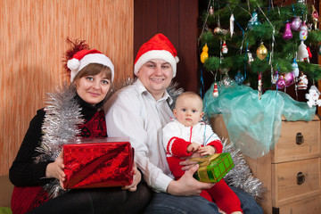 Obraz na płótnie Canvas family near Christmas tree