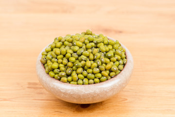 Green mung beans in bowl on the table