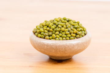 Green mung beans in bowl on the table