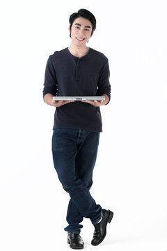 Young Man In Casual And Relax Smiling With Lab Top Computer