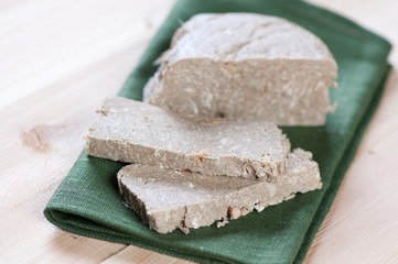 Sliced sunflower halva on a green serviette, studio shot