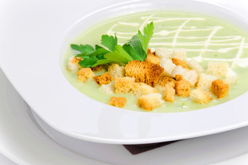 Green soup with croutons