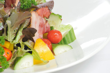 salad with cucumber tomato bacon