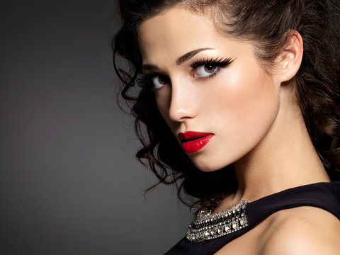 brunette woman with fashion makeup and red lips
