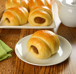Buns with meat on a brown table