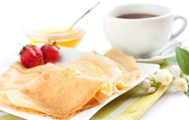 thin pancakes and a cup of tea