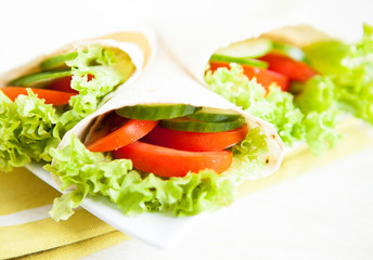cucumbers, tomatoes and salad in pita