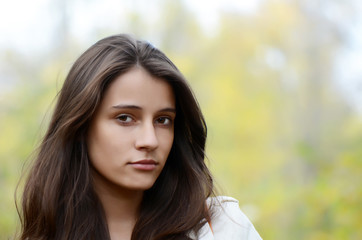 Naklejka premium Portrait of the young girl on the nature