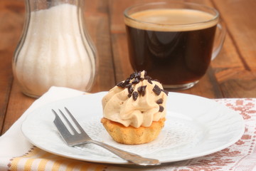 Cap of coffee and cream cakes