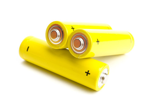 yellow alkaline batteries isolated on white background