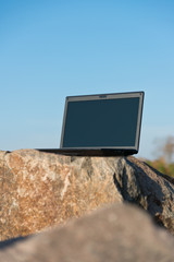 Laptop on rocks