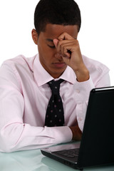 Worried businessman at a laptop