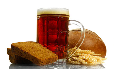 tankard of kvass and rye breads with ears, isolated on white
