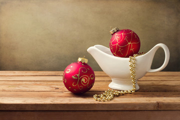 Christmas background with ornaments and gravy boat