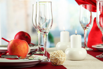 beautiful holiday table setting with apples, close up
