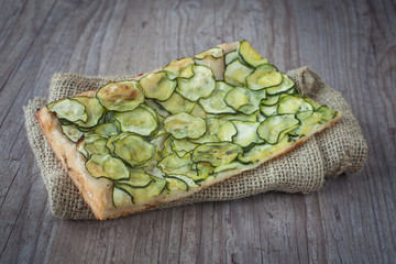 Sliced pizza with zucchini