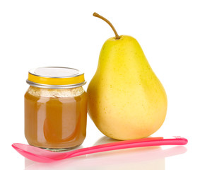 Useful and tasty baby food with pear and spoon isolated on