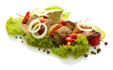 tasty grilled meat and vegetables on skewers, isolated on white