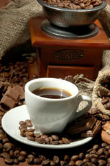 cup of coffee, grinder, turk and coffee beans