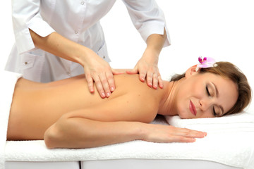 Fototapeta na wymiar beautiful woman in spa salon getting massage, isolated on