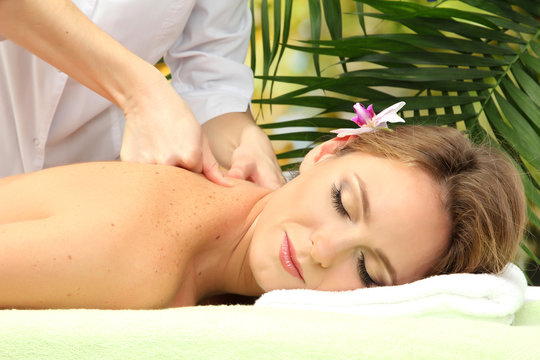 beautiful woman in spa salon  getting massage,
