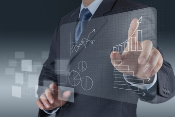 businessman hand drawing a pie chart