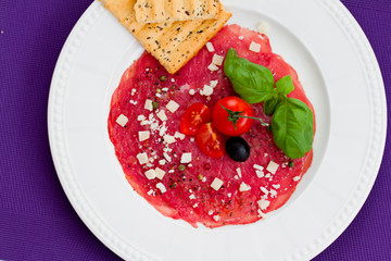 Carpaccio with olives and parmesan