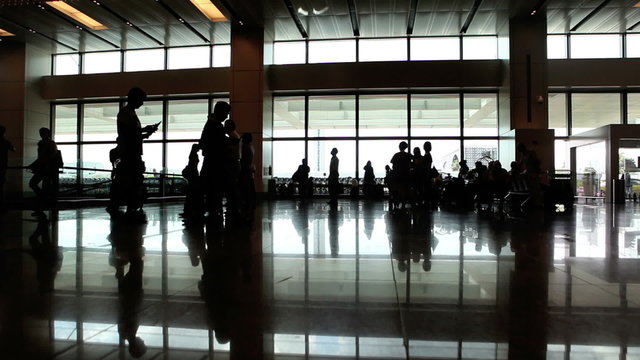 Silhouette of people waiting in airport
