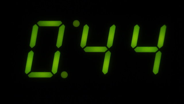 A green LED digital countdown clock. One minute