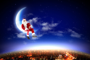 Obraz na płótnie Canvas Santa na Księżycu