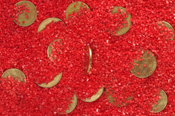coins in the sand