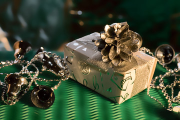 box with cone and garland on gree background