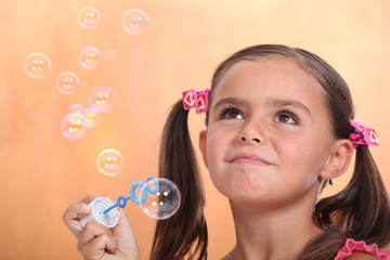 Girl blowing bubbles