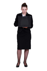 Businesswoman holding laptop