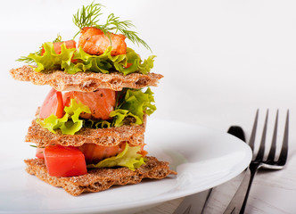 Salad from a fried salmon with a lemon and fennel