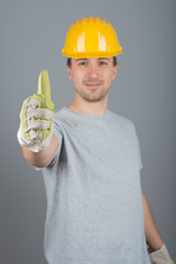 Young male construction worker, with finger up