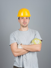 Young male construction worker, with arms crossed