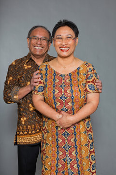 Senior Indonesian Couple In Love. Traditional Clothing. Studio.