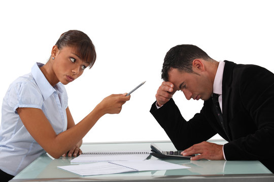 Woman scolding an ashamed man