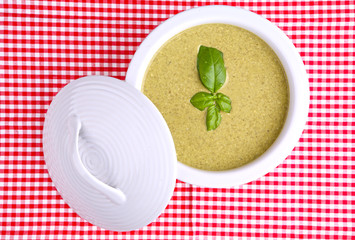 basil cream soup  on a checked table cloth