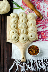Fototapeta na wymiar Dumplings on the cutting Board