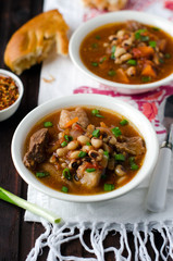 Thick tomato soup with beans and meat