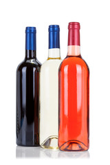 Three bottles of wine isolated on white background