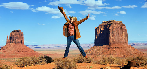 cowgirl jumping at Monument Valley