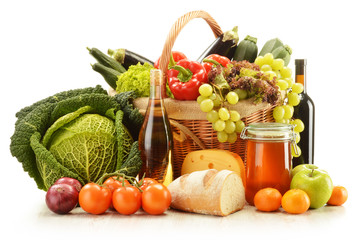 Composition with grocery products in wicker basket isolated