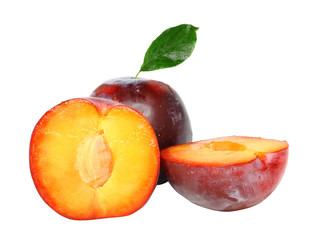 Heap of plums with green leaf. Isolated.
